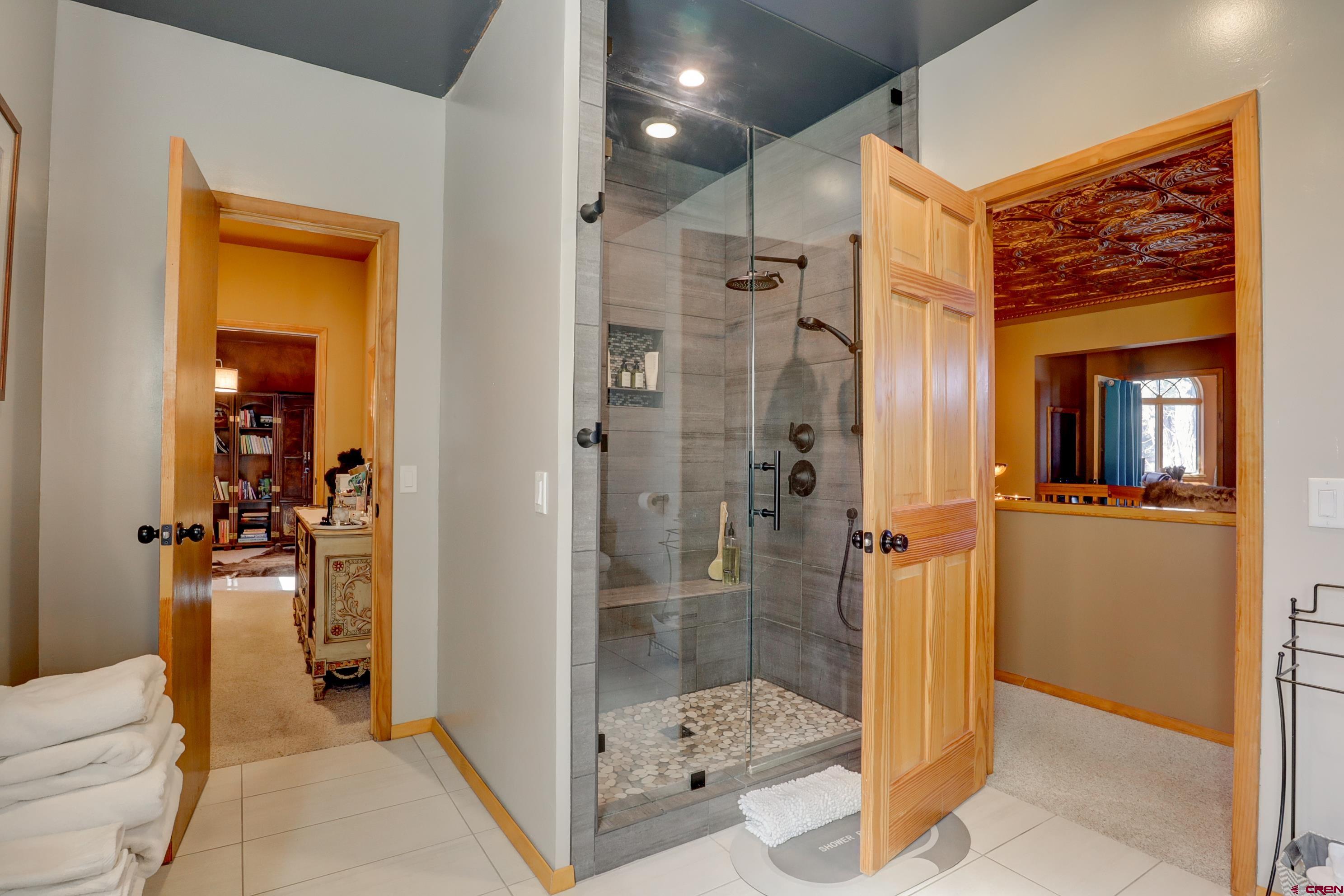 18656 Highway 145 Dolores, CO 81323 - Photo 24 of 45 Bathroom with tile patterned floors, baseboards, and a shower stall