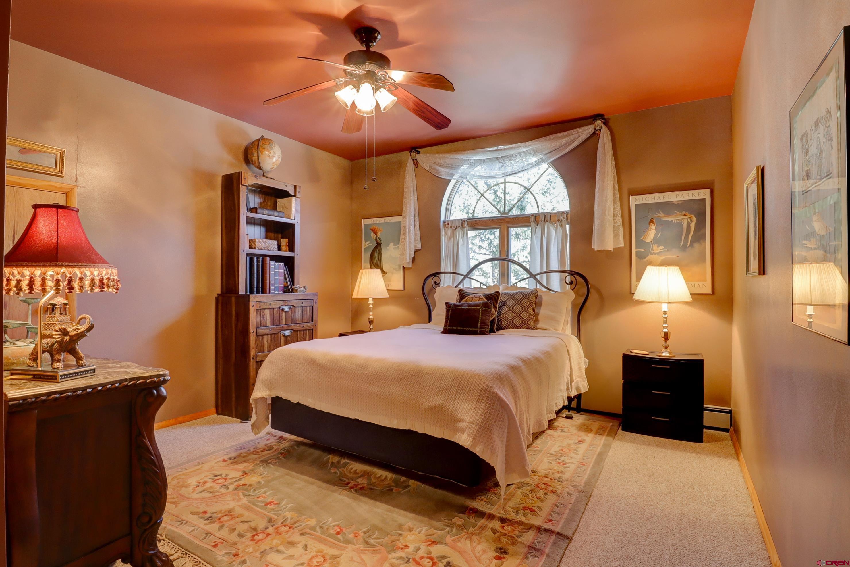 18656 Highway 145 Dolores, CO 81323 - Photo 26 of 45 Bedroom featuring ceiling fan, baseboards, and carpet