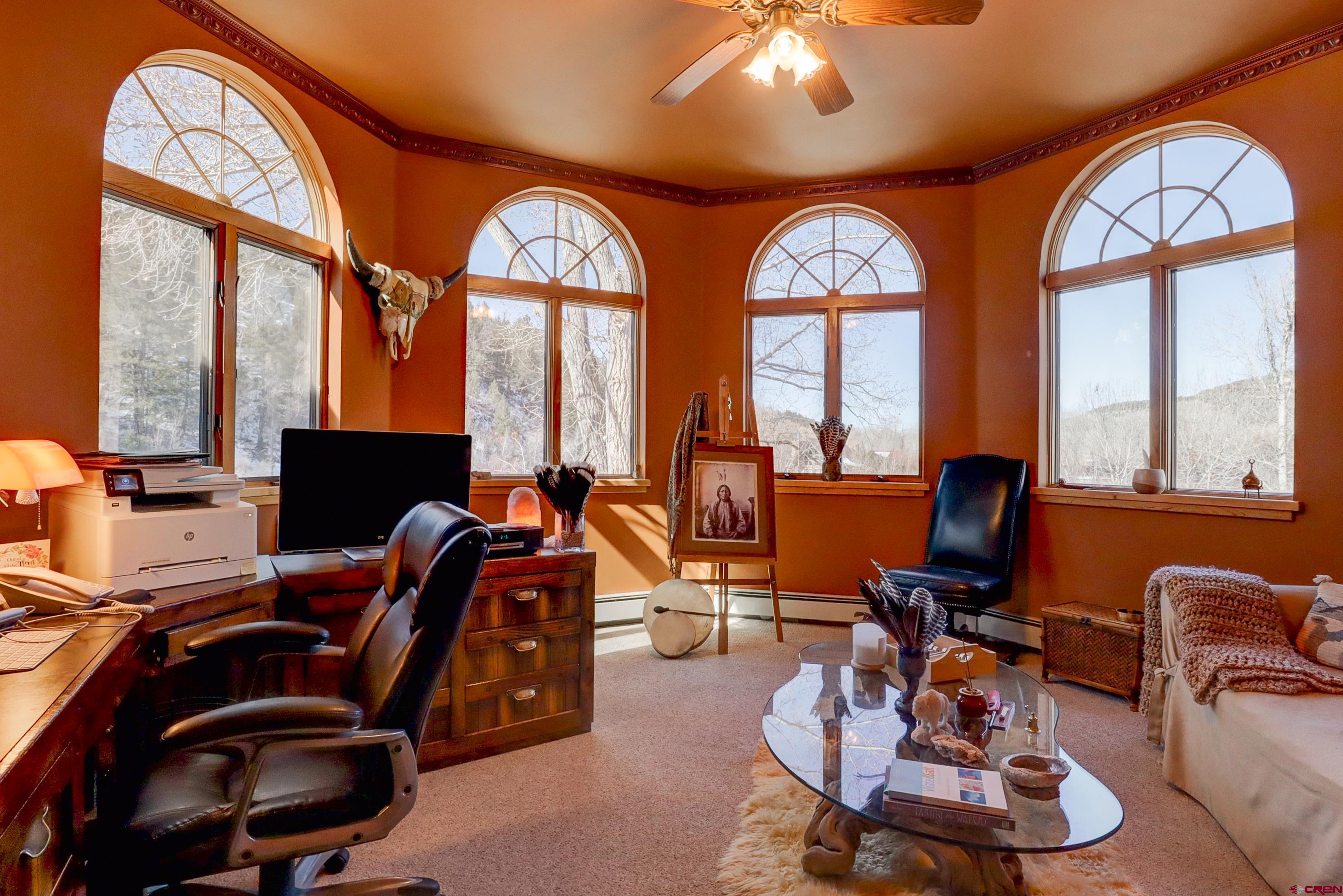 18656 Highway 145 Dolores, CO 81323 - Photo 28 of 45 Carpeted office space with baseboards, baseboard heating, a ceiling fan, and crown molding