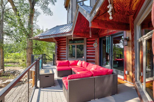 a view of a chairs and table in the patio