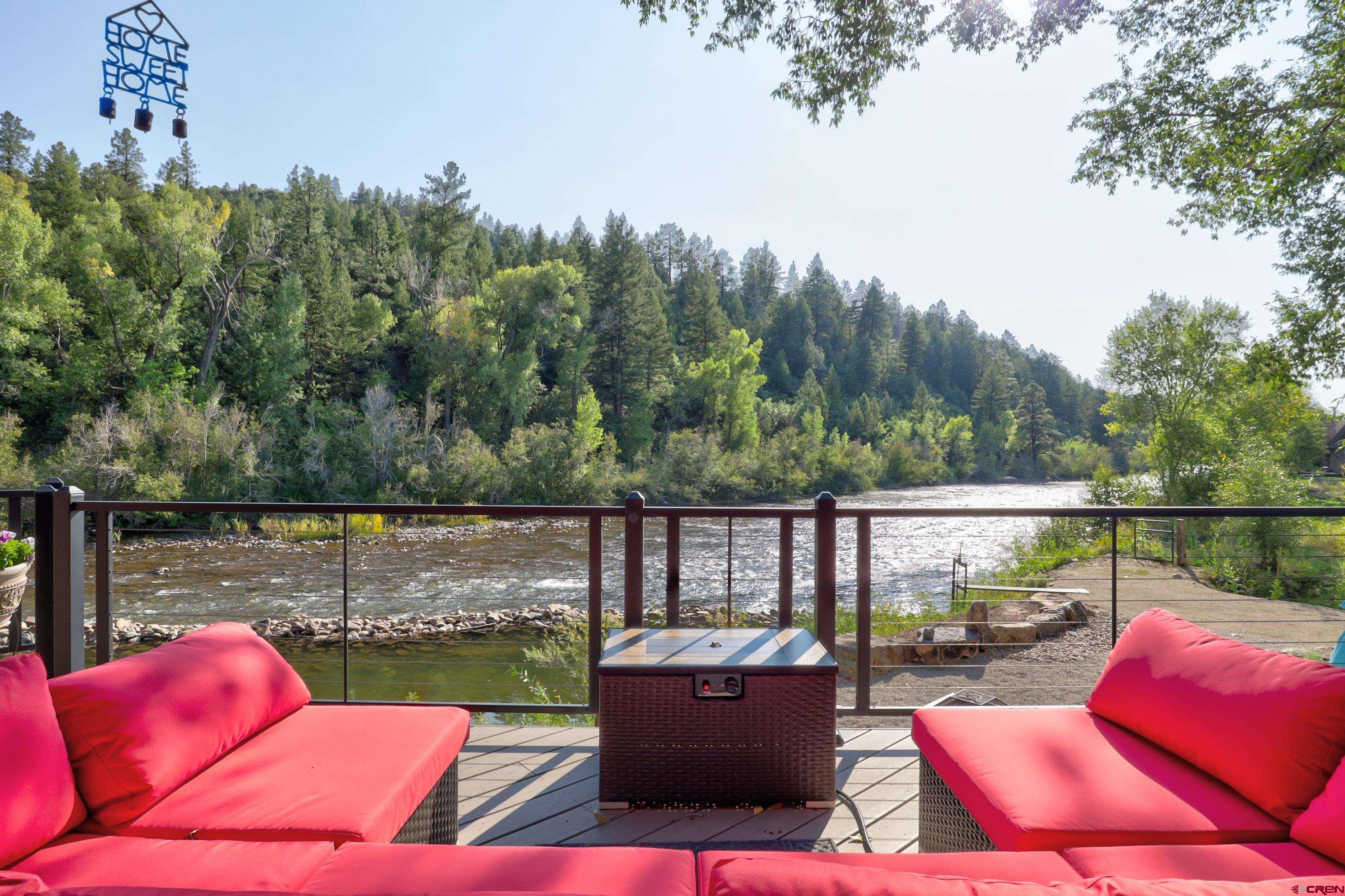 18656 Highway 145 Dolores, CO 81323 - Photo 31 of 45 Wooden terrace with an outdoor living space, a wooded view, and a water view