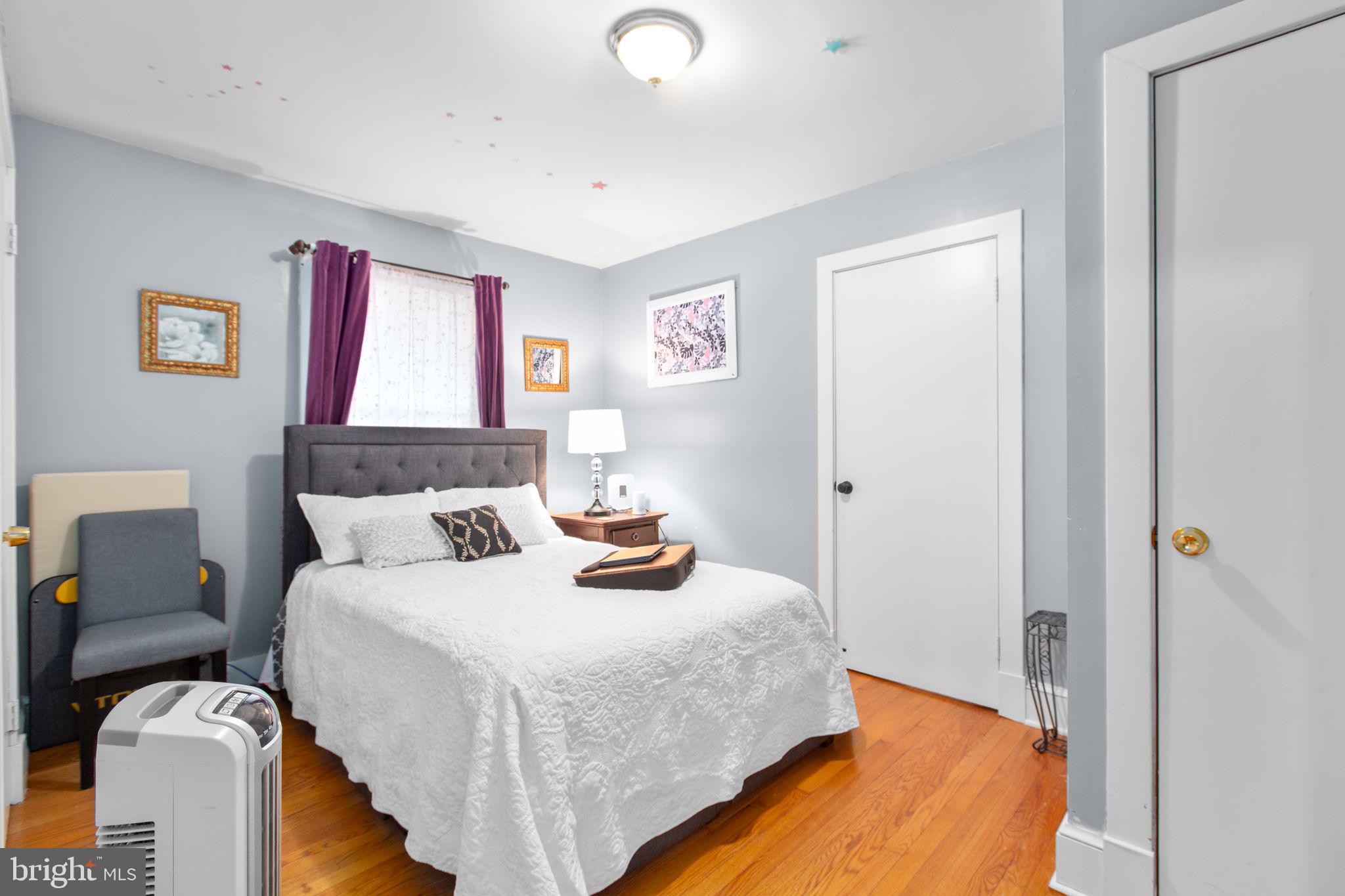 80 Ferry Road Fredericksburg, VA 22405 - Photo 15 of 39 a bedroom with a bed and wooden floor