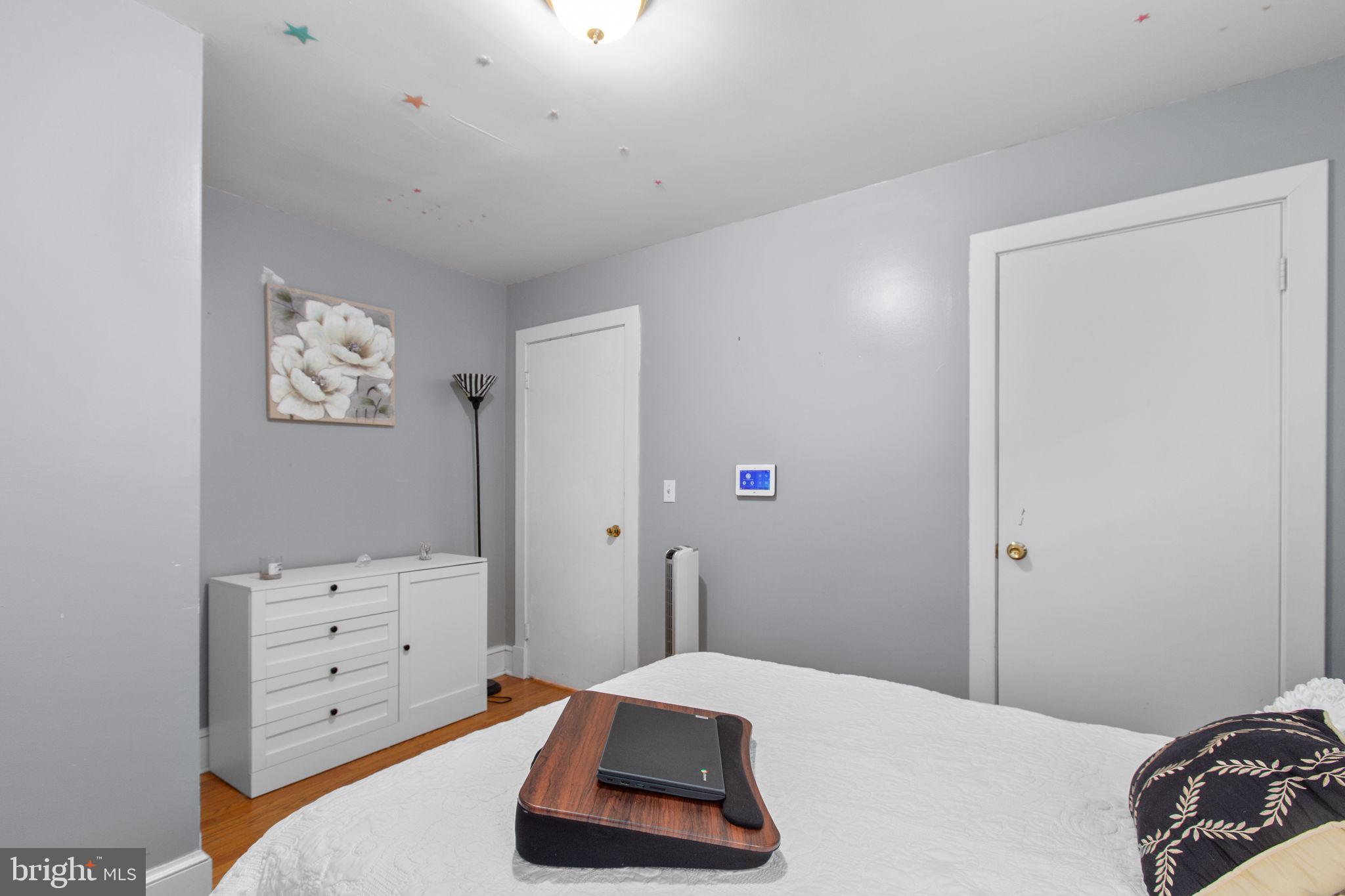 80 Ferry Road Fredericksburg, VA 22405 - Photo 16 of 39 a bedroom with a bed and a cabinets