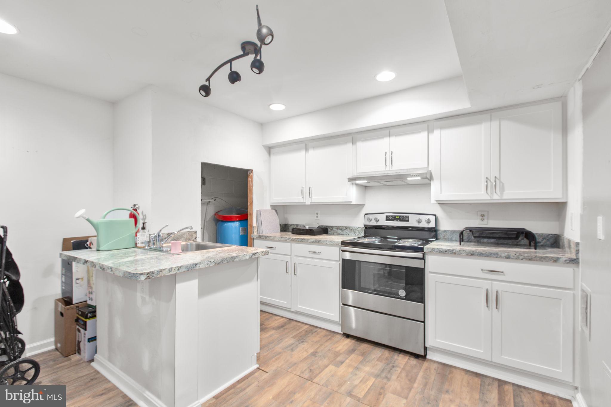 80 Ferry Road Fredericksburg, VA 22405 - Photo 23 of 39 a kitchen with stainless steel appliances granite countertop a stove a sink dishwasher and a refrigerator