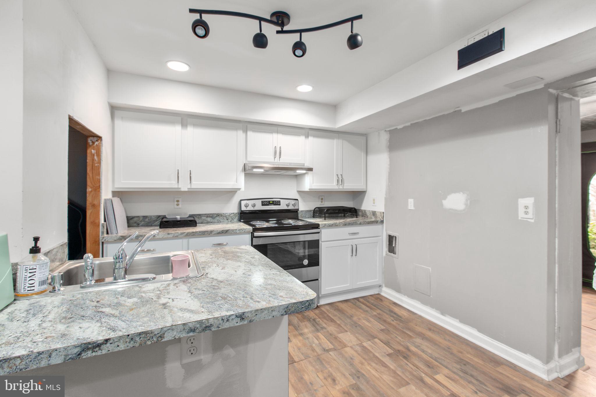 80 Ferry Road Fredericksburg, VA 22405 - Photo 24 of 39 a kitchen with a refrigerator sink and stove