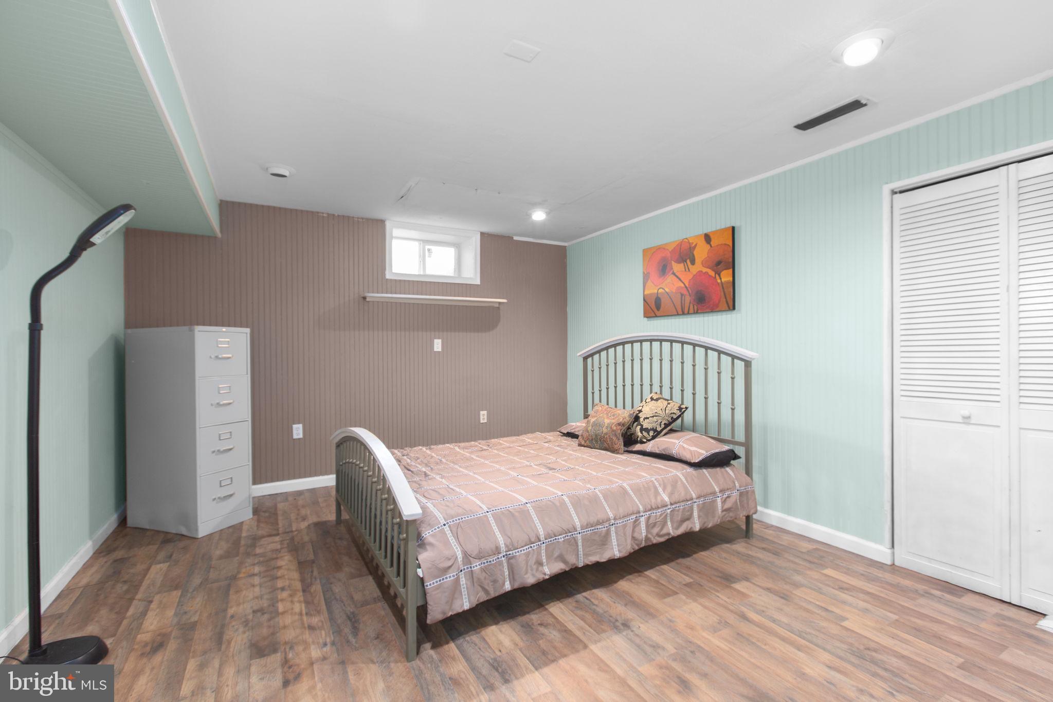 80 Ferry Road Fredericksburg, VA 22405 - Photo 25 of 39 a bedroom with a bed and a painting on the wall