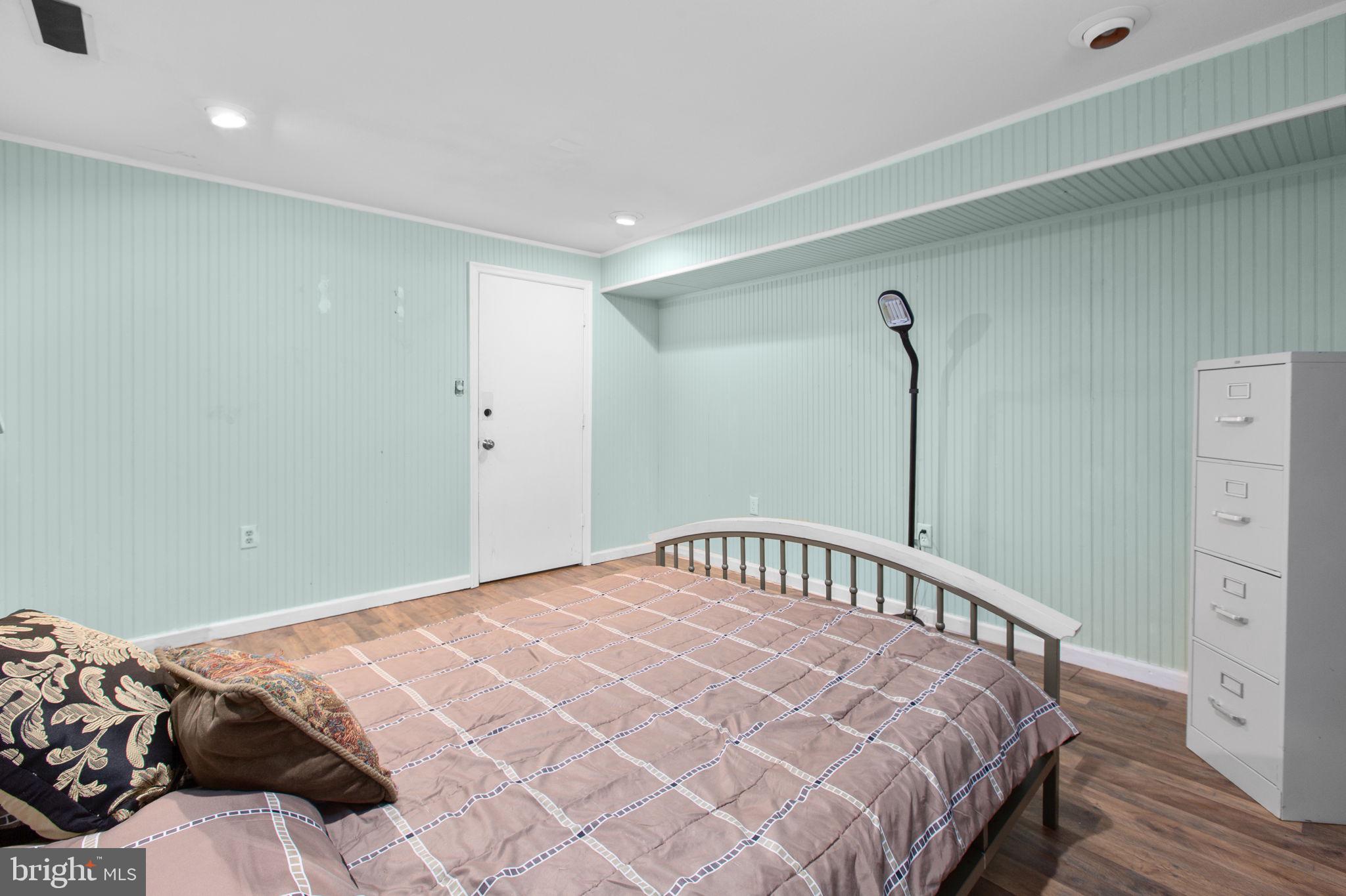 80 Ferry Road Fredericksburg, VA 22405 - Photo 26 of 39 a bedroom with a bed and wooden floor