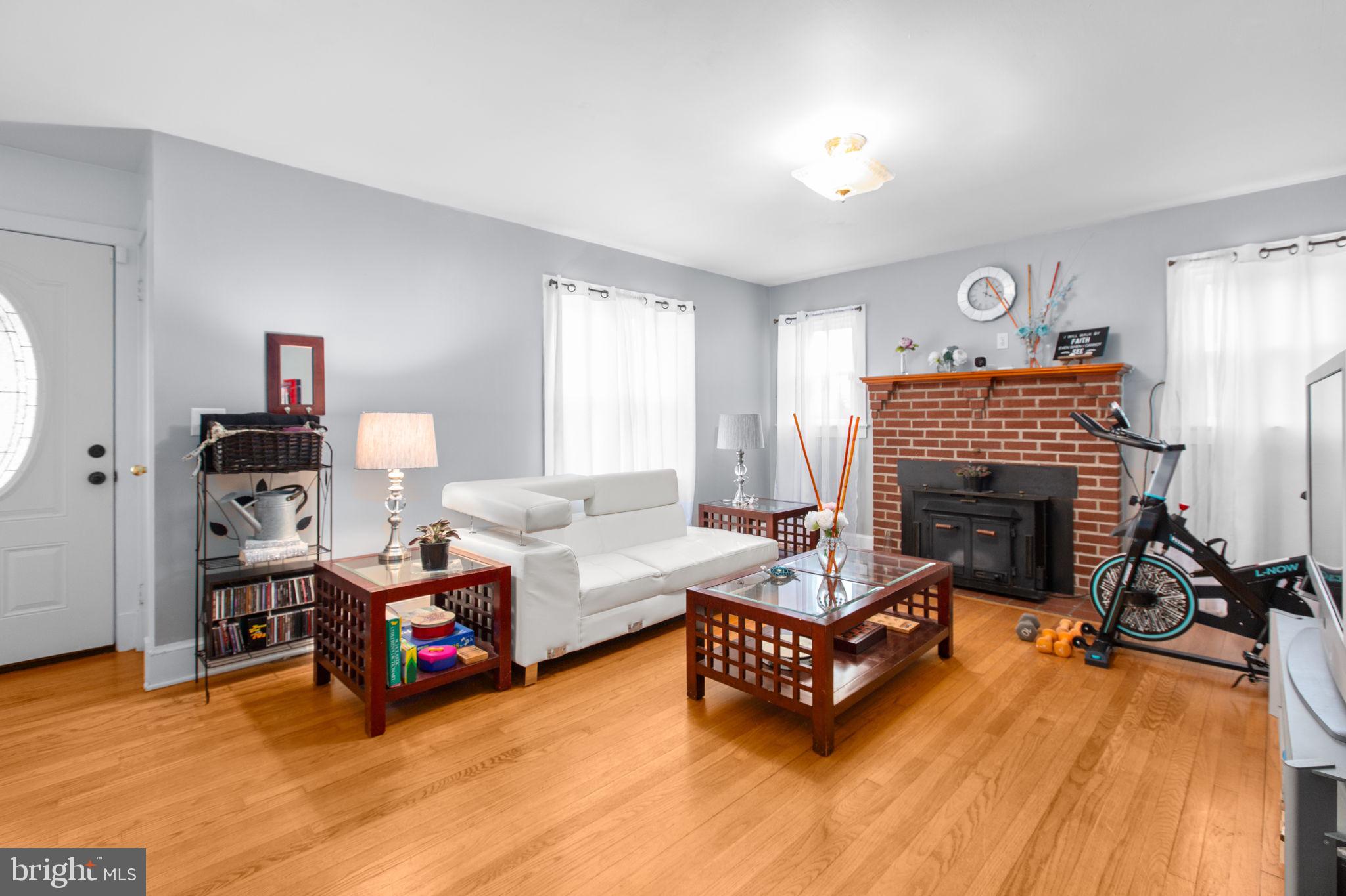 80 Ferry Road Fredericksburg, VA 22405 - Photo 5 of 39 a living room with furniture and a fireplace
