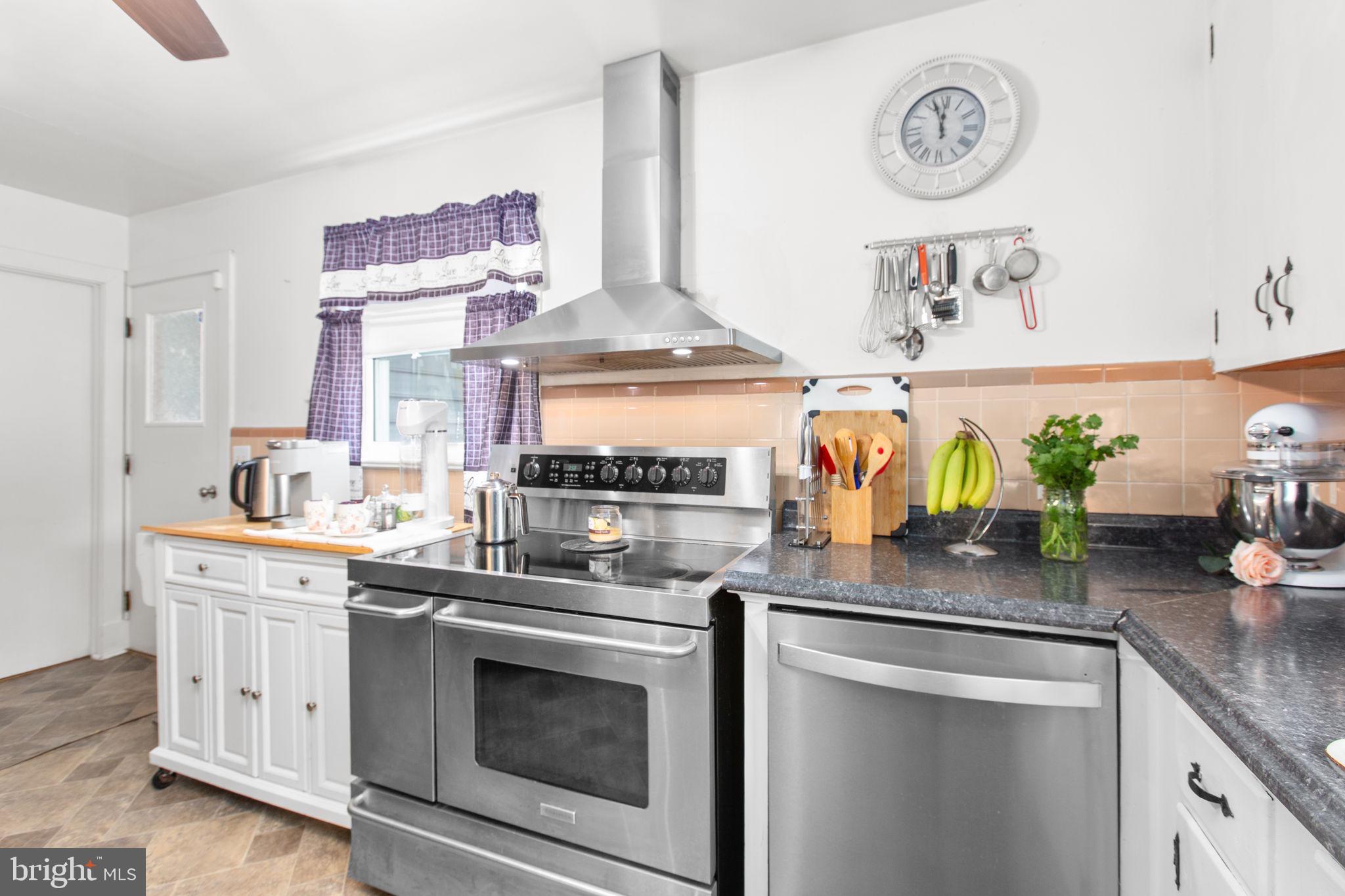 80 Ferry Road Fredericksburg, VA 22405 - Photo 10 of 39 a kitchen with stainless steel appliances granite countertop a stove a sink and cabinets