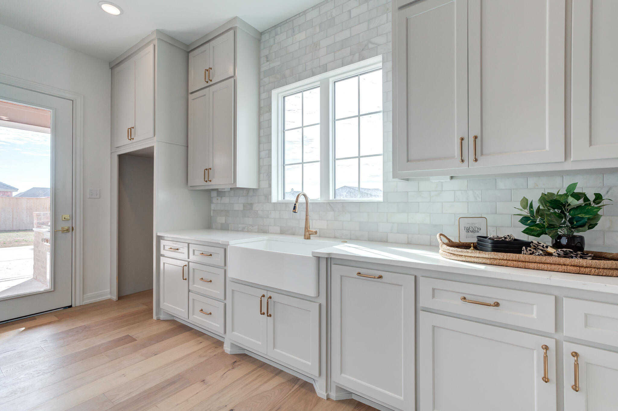 5309 County Road 7670 Lubbock, TX 79424 - Photo 39 of 53 a kitchen with white cabinets and sink