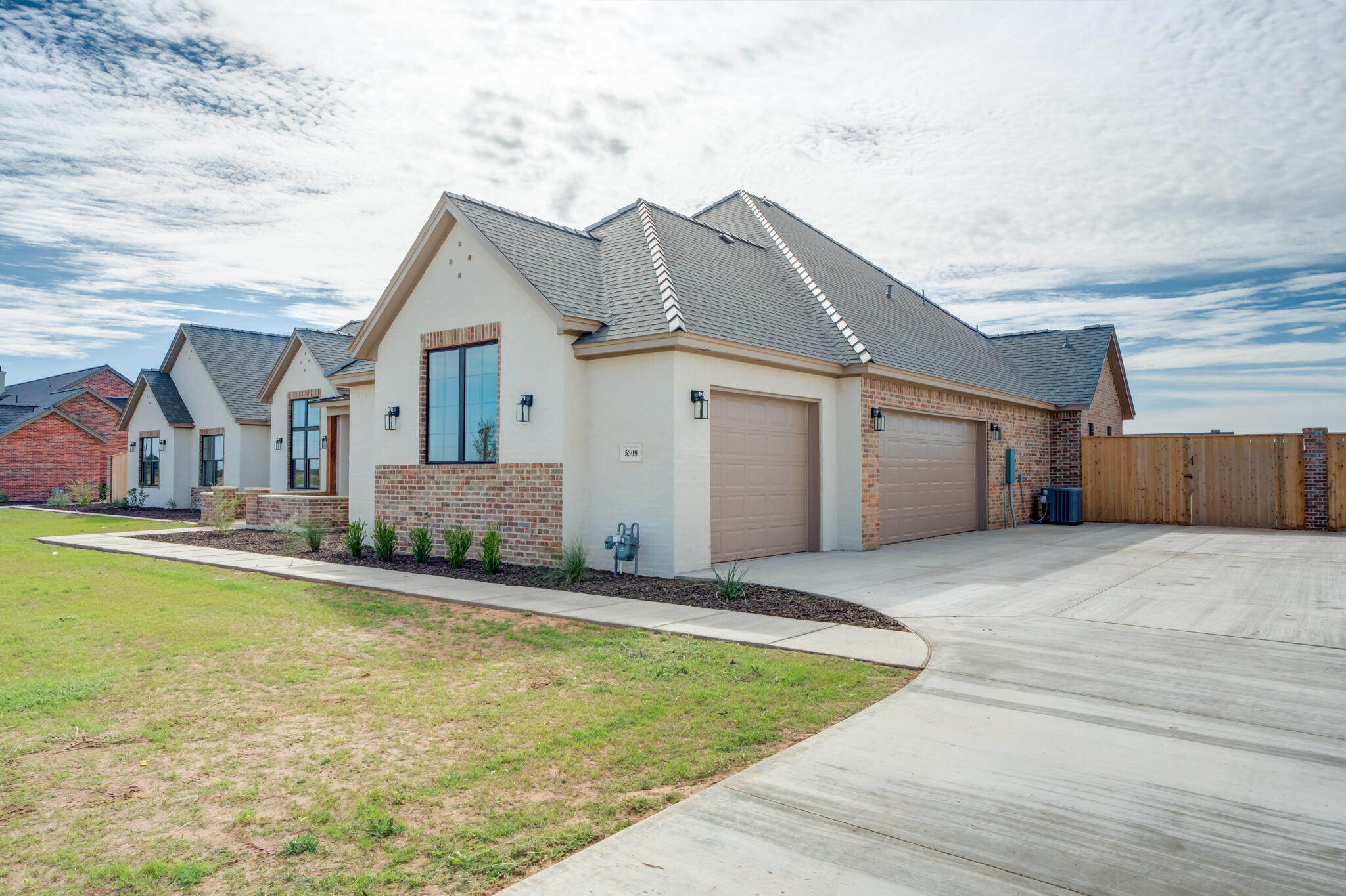 5309 County Road 7670 Lubbock, TX 79424 - Photo 4 of 53 a front view of house with yard and garage