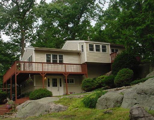 3 Hunter Road Danbury, CT 06811 - Photo 1 of 1 a front view of a house with a garden