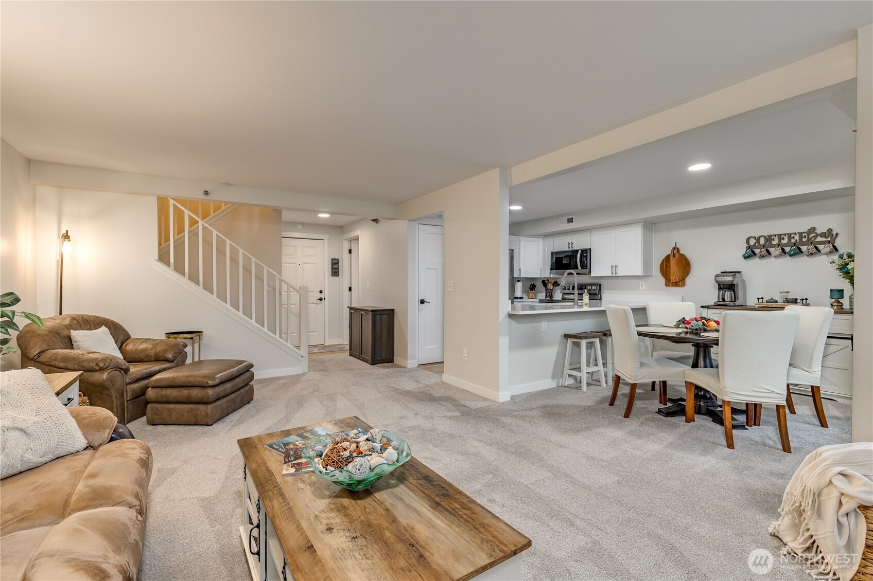 3939 10th Street Southeast, Unit B4 Puyallup, WA 98374 - Photo 2 of 25 a living room with furniture and a wooden floor