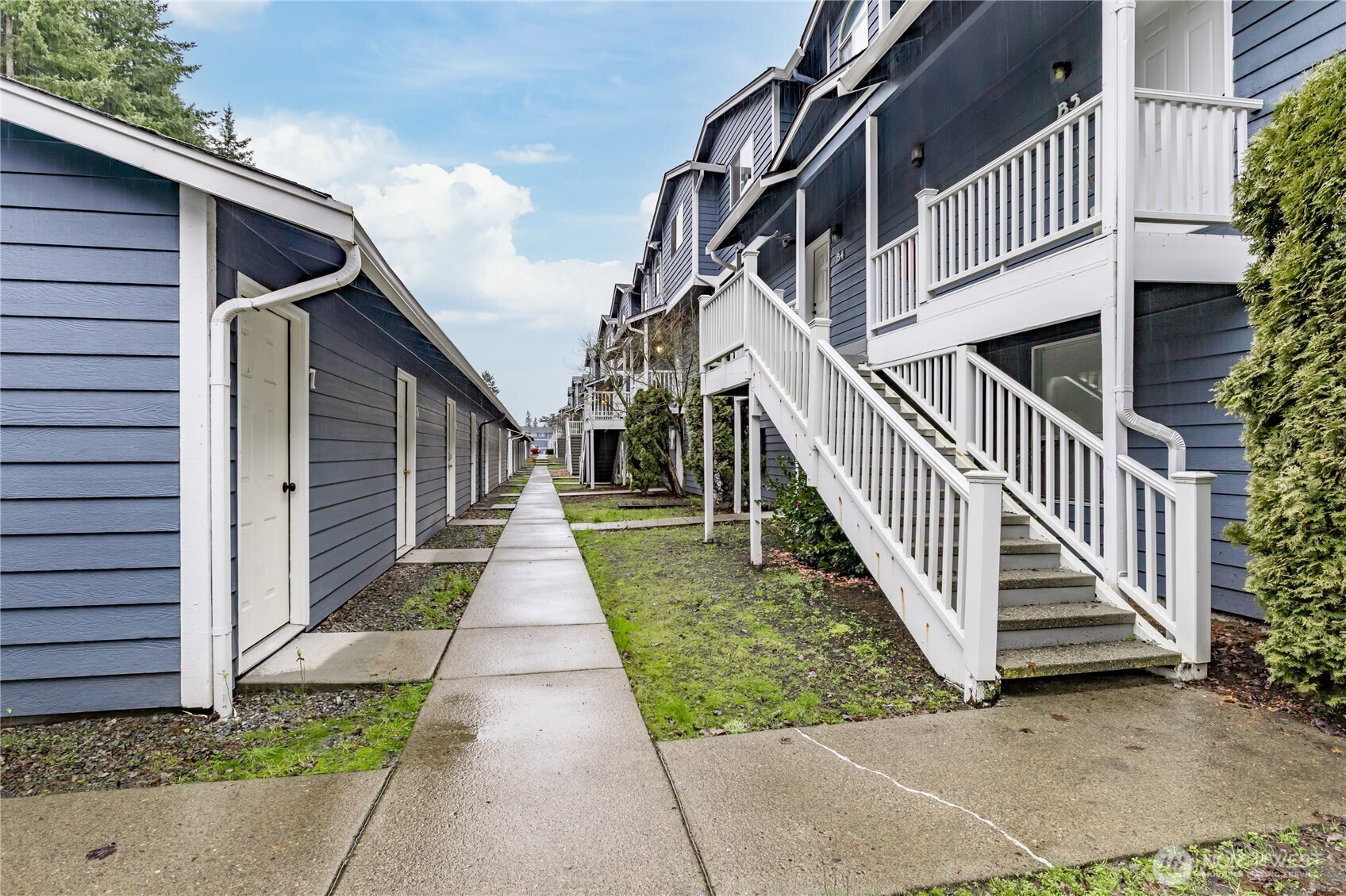 3939 10th Street Southeast, Unit B4 Puyallup, WA 98374 - Photo 21 of 25 a view of a pathway of a house with wooden fence