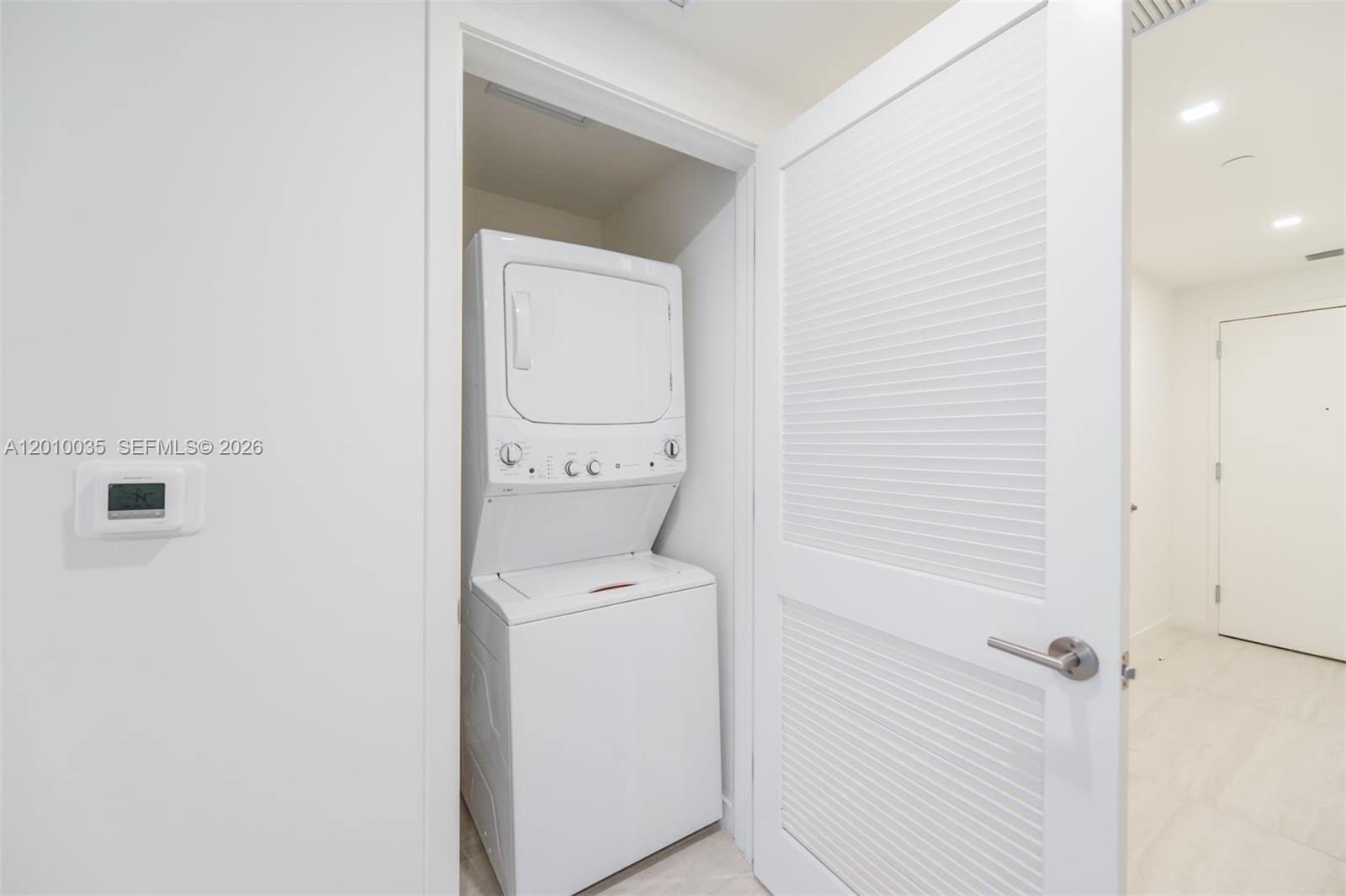 77 Southeast 5th Street, Unit 2603 Miami, FL 33131 - Photo 12 of 67 a view of bathroom with a washer and dryer
