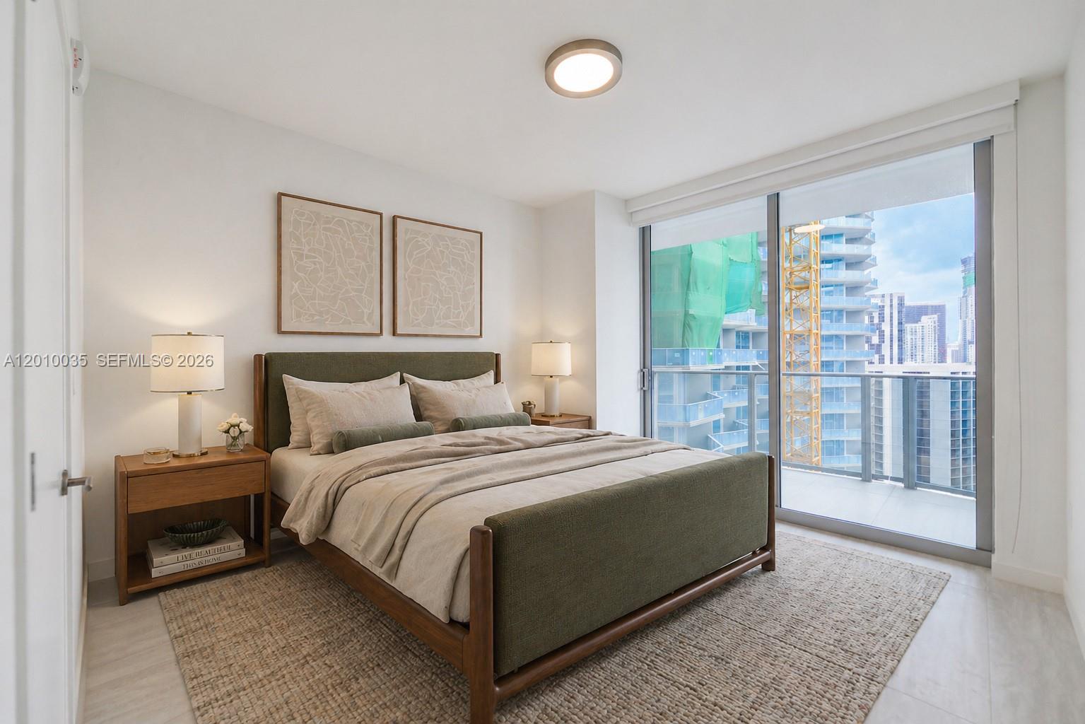 77 Southeast 5th Street, Unit 2603 Miami, FL 33131 - Photo 27 of 67 a bed sitting in a bedroom next to a window