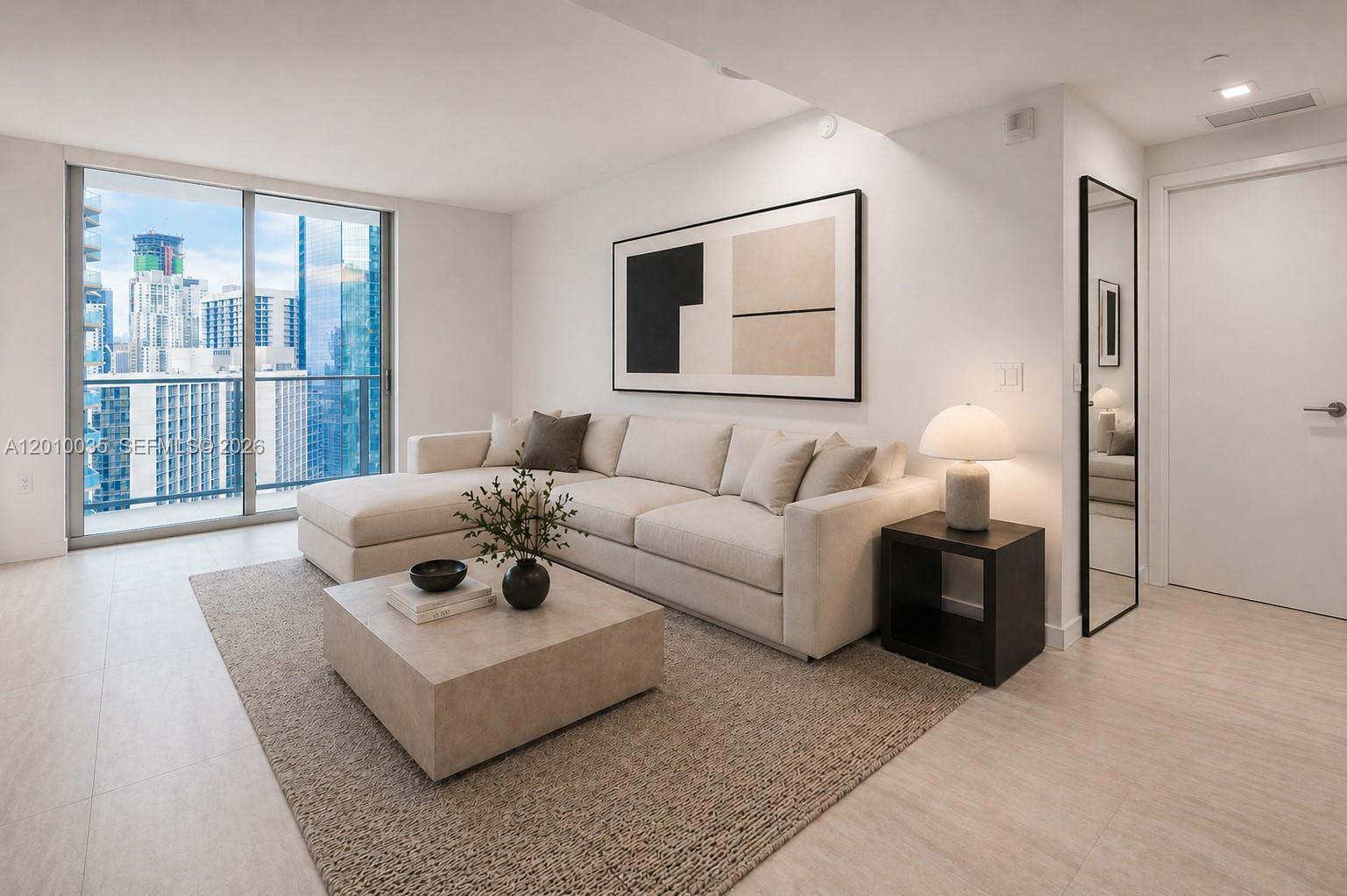 77 Southeast 5th Street, Unit 2603 Miami, FL 33131 - Photo 4 of 67 a living room with furniture and a large window