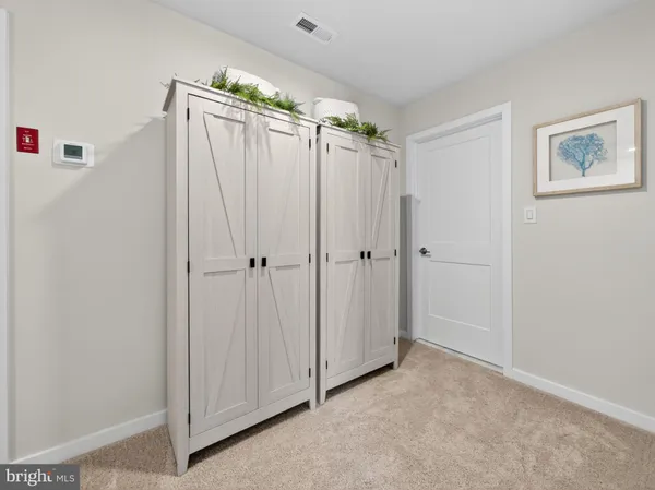 a view of a bathroom with a shower and a sink