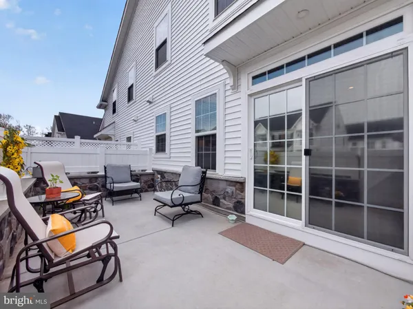 a outdoor space with patio the couches and a dining table with chairs