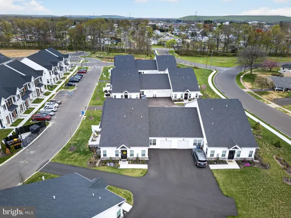 an aerial view of a house with a garden