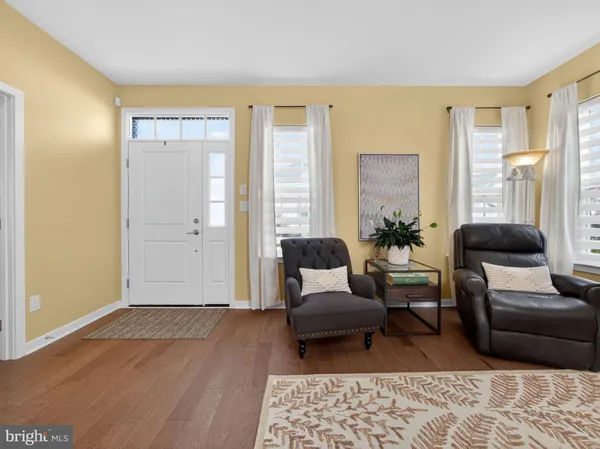 a living room with furniture and a rug