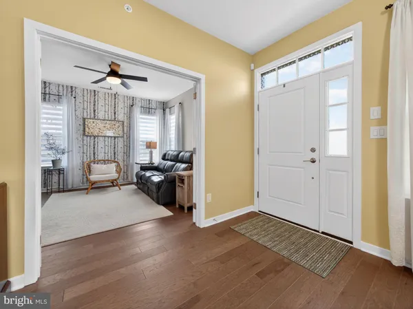 a view of a livingroom with furniture and front door