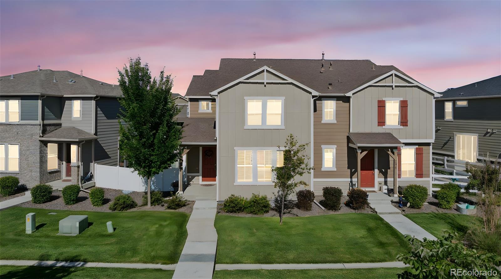 5097 Buckwheat Road Brighton, CO 80640 - Photo 2 of 28 a front view of a house with a yard