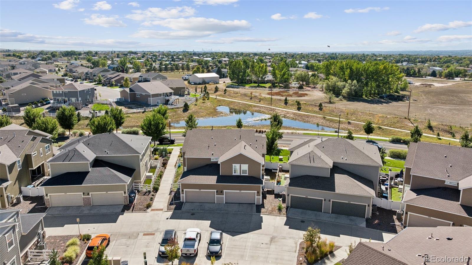 5097 Buckwheat Road Brighton, CO 80640 - Photo 22 of 28 an aerial view of a houses with a city view