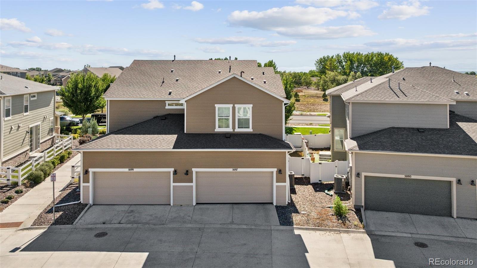 5097 Buckwheat Road Brighton, CO 80640 - Photo 23 of 28 a front view of a house with a yard