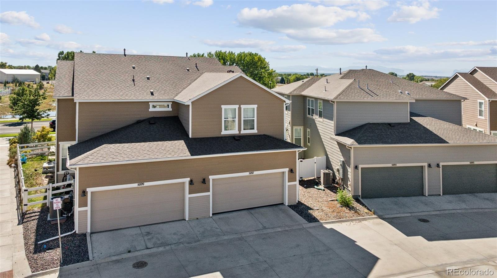 5097 Buckwheat Road Brighton, CO 80640 - Photo 24 of 28 a view of a house with a parking space