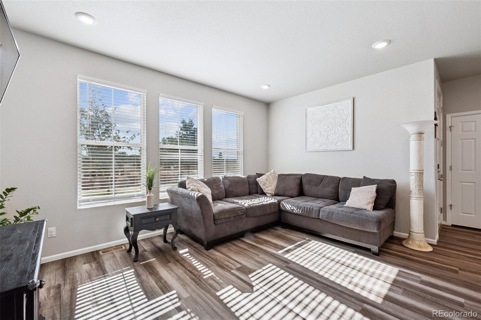 5097 Buckwheat Road Brighton, CO 80640 - Photo 5 of 28 a living room with furniture and a window