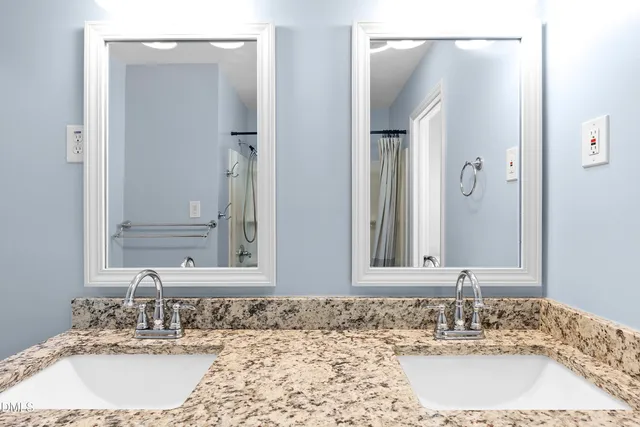 a view of a livingroom with wooden floor and a ceiling fan
