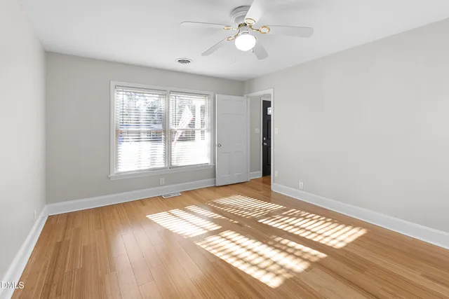 a view of a bathroom with a sink and a mirror