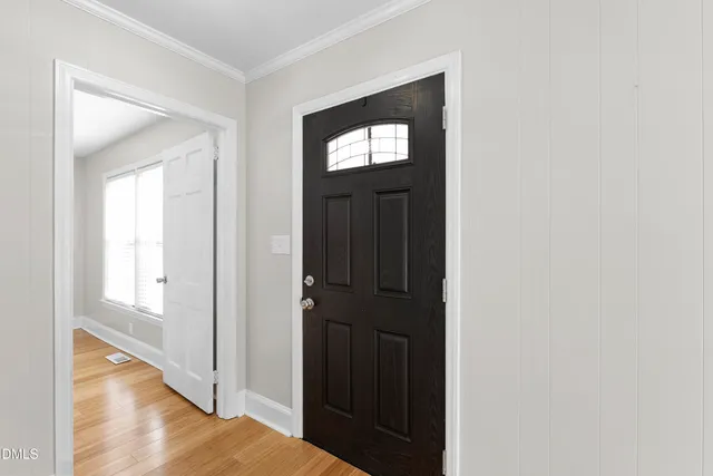 a kitchen with stainless steel appliances granite countertop wooden cabinets a stove top oven a sink and dishwasher