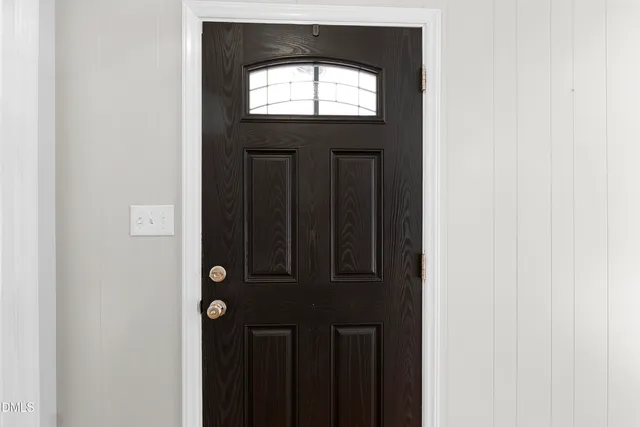 a kitchen with granite countertop stainless steel appliances sink and wooden cabinets
