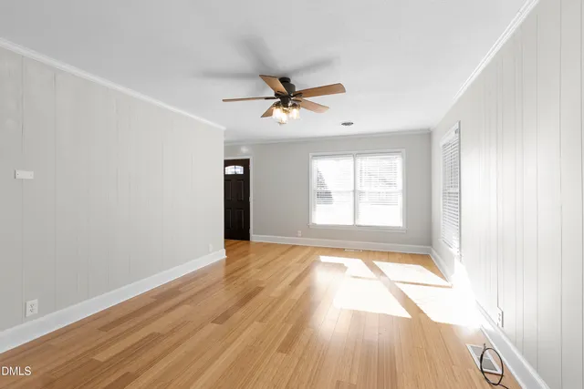 a view of a street with potted plants