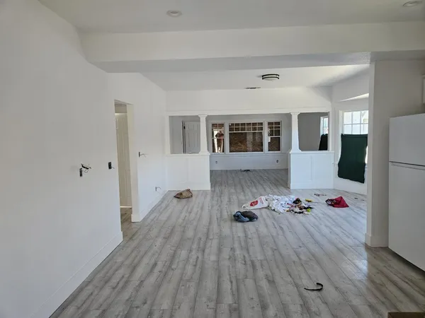 a room with furniture and wooden floor