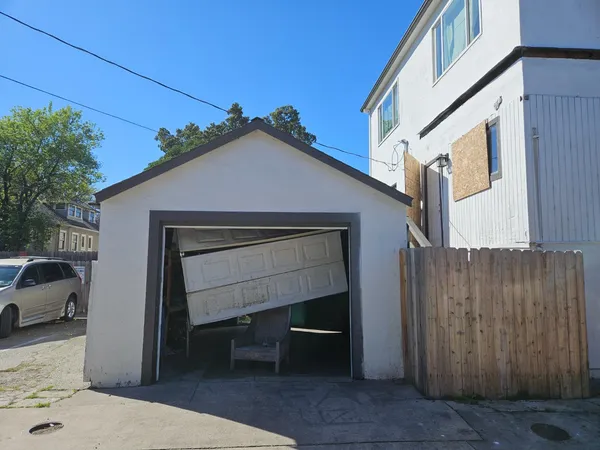 a front view of a house with garage