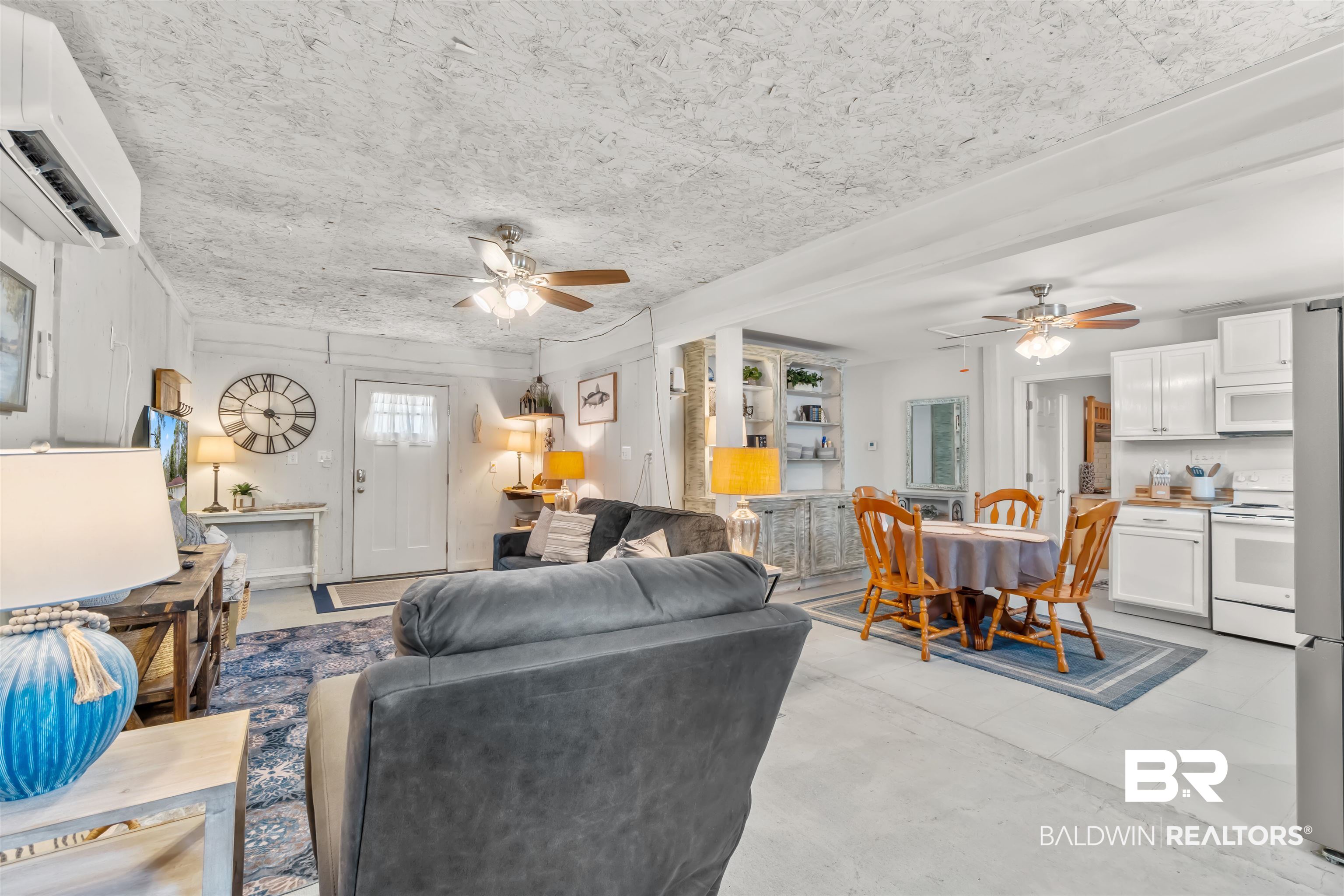 17595 River Road Summerdale, AL 36580 - Photo 4 of 29 Living area featuring ceiling fan and concrete flooring