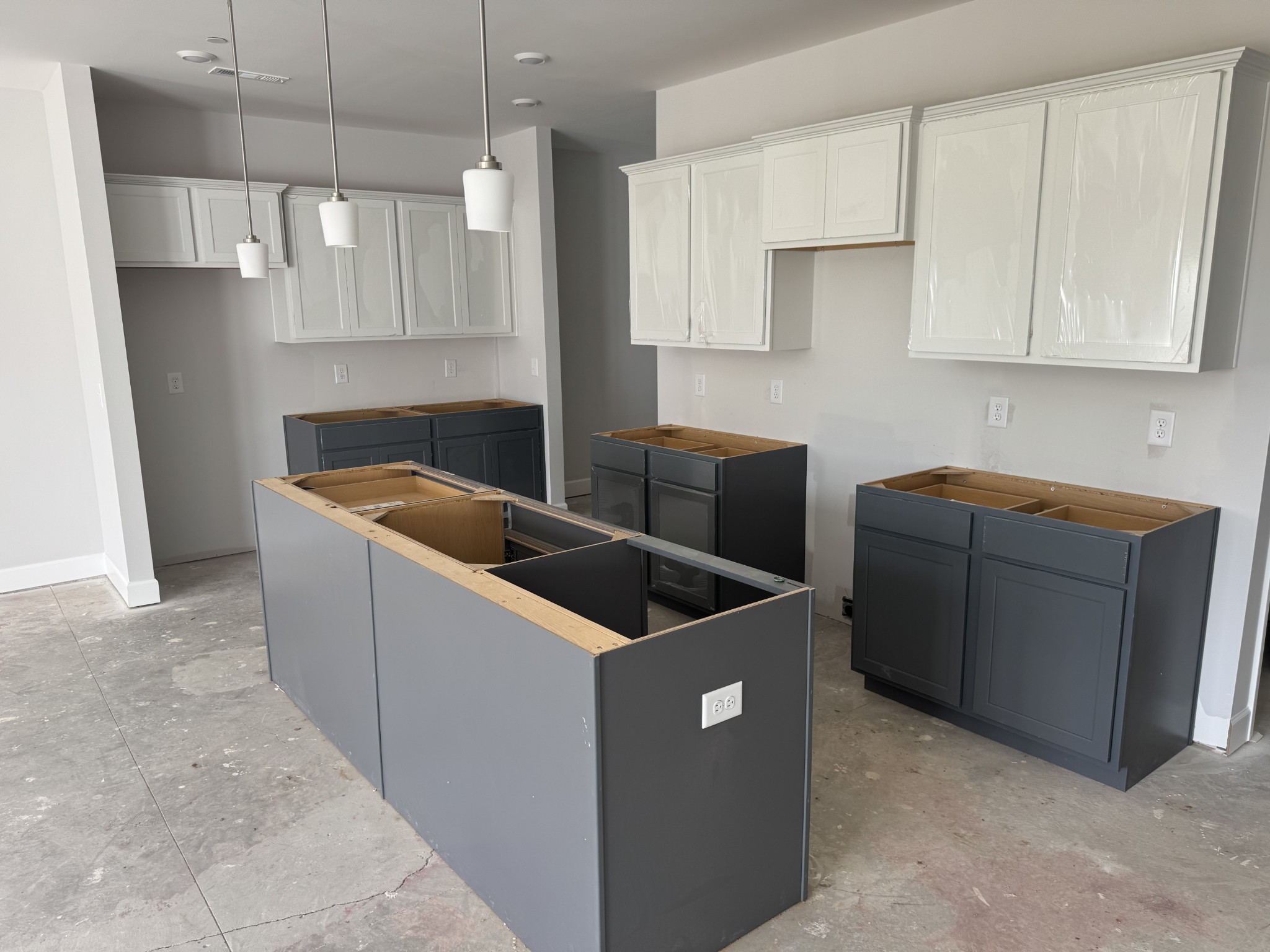 1097 June Wilde Ridge Spring Hill, TN 37174 - Photo 3 of 15 a kitchen with stainless steel appliances granite countertop a sink and a white cabinets