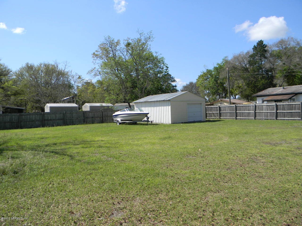 6418 Firestone Road Jacksonville, FL 32244 - Photo 8 of 8 a view of a house with a backyard