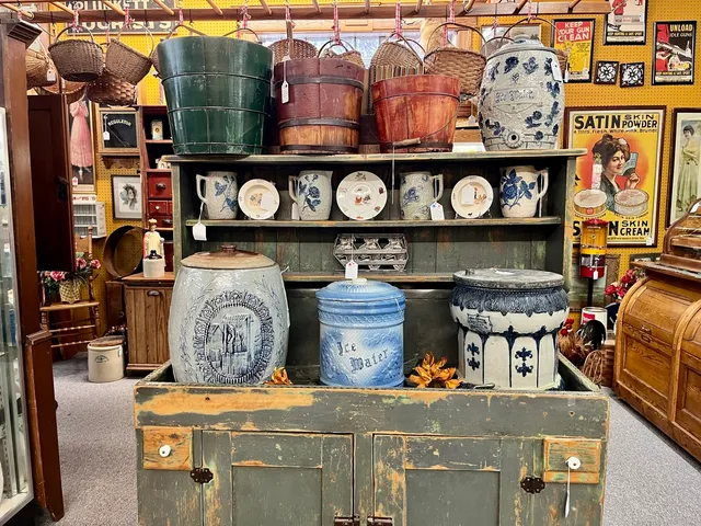 a kitchen with stainless steel appliances kitchen island granite countertop a stove and cabinets