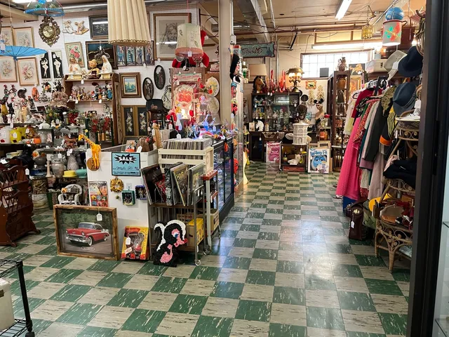 a large kitchen with stainless steel appliances granite countertop a lot of counter space and a window
