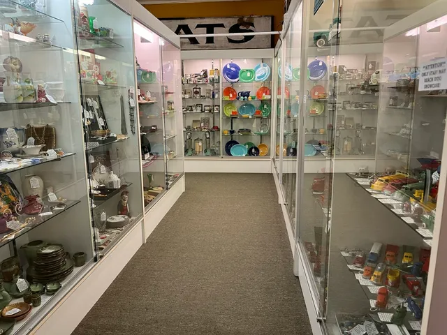 a living room with furniture a chandelier and a rug