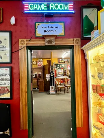 a room with lots of furniture and air hockey table