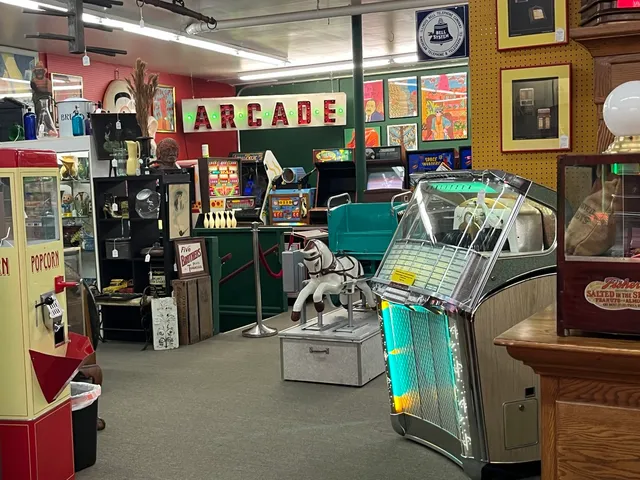 a bedroom with a bed dresser and window