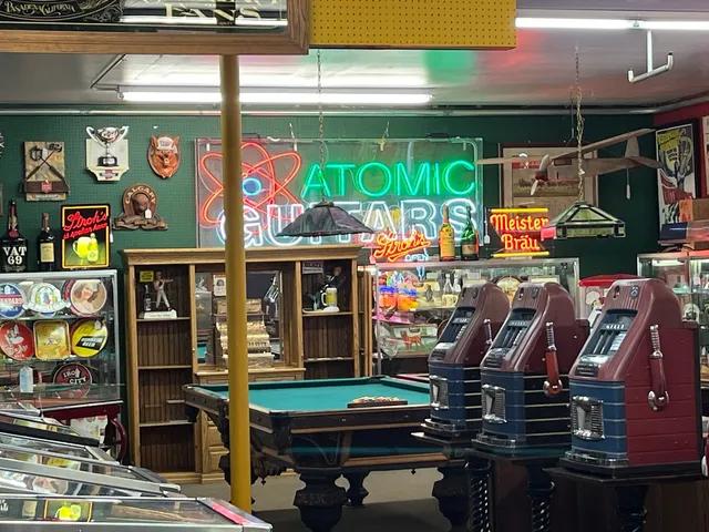 a bathroom with a granite countertop toilet sink and mirror