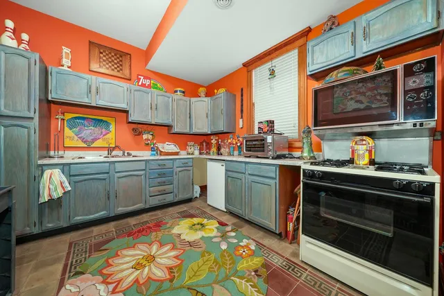 a view of a chairs and table in a balcony