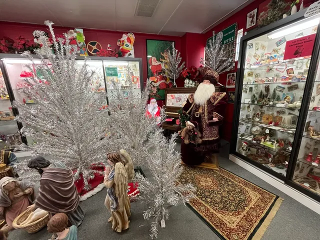 a view of a living room with furniture and floor to ceiling windows