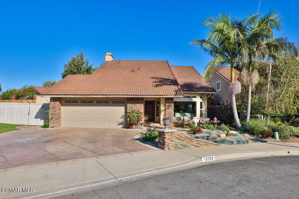 13520 Bear Valley Road Moorpark, CA 93021 - Photo 2 of 53 a front view of a house with garden